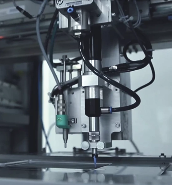 Automated dispensing equipment applying material to a flat panel assembly